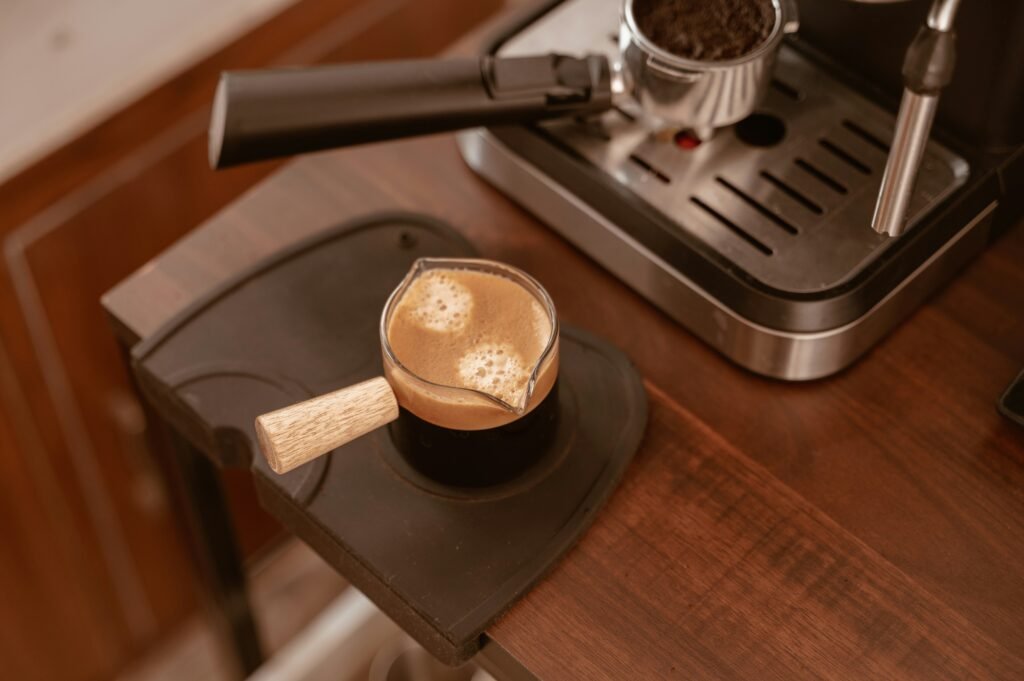 a cup of coffee sitting on top of a wooden table a cup of coffee sitting on top of a wooden table
